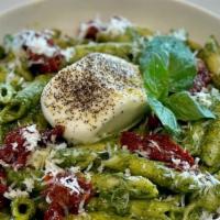 Penne Pesto Burrata · Penne pasta, with home-made pesto sauce, topped with fresh Burrata cheese and sun-dried toma...