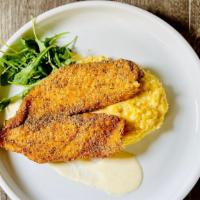 Southern Catfish & Grits · One-piece fried catfish, stone grain creamy grits and Cajun cream sauce.