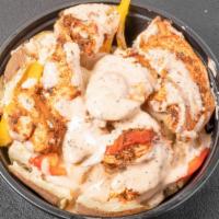 Chicken Alfredo Spud · Baked Potato Loaded with Grilled chicken, Alfredo Sauce, Tri Peppers, Onions and Parsley