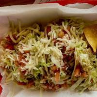 El Carnal Taco · Beans, lettuce, pico de gallo, and cheese.