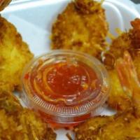 Coconut Shrimps (5) · Deep fried coconut buttery shrimps served with thai sweet chili sauce.