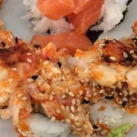 Volcano Roll · Cucumber, cream cheese and sesame seeds topped with scallop dynamite.
