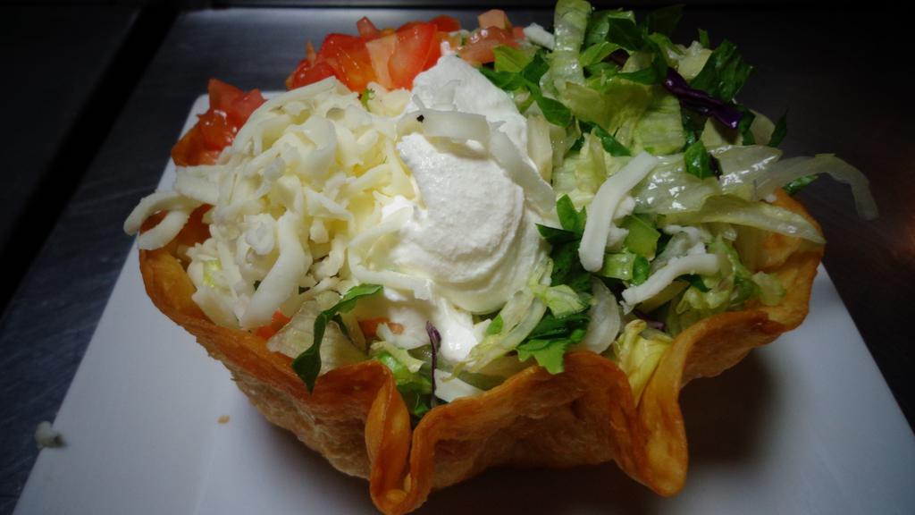 Taco Salad Lunch · Shredded Chicken Or ground beef with cheese dip, lettuce, sour cream, tomatoes and shredded cheese.