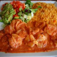 Camarones Alchipotle · Twelve shrimp with onions and chipotle sauce. Served with rice and beans.