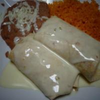 Burrito Friends · Two burritos with your choice of meat smothered in cheese. served with rice and beans.