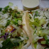 Shrimp Tacos Lunch · Two soft corn tacos filled with lettuce, cilantro, cheese, rice and beans, beans.