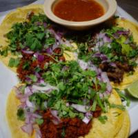 Tacos Mexican Style · Three corn Or flour tortillas filled with your choice of steak, chorizo, pork, Grilled Chick...