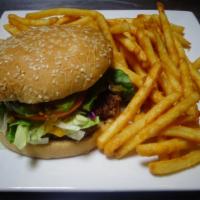 Mexican Burger · Try this delicious burger with Chicken breast Or beef, cheese, lettuce, tomatoes and avocado...