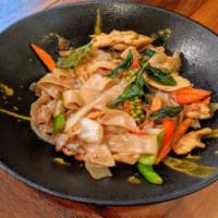 Drunken Noodle (Vg) · Flat rice noodle, Thai basil, carrot, bell pepper, onion, Thai chili, crispy basil, spicy ba...