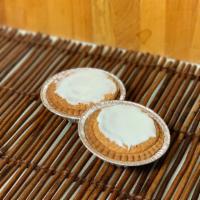 Mazarin Tart · A smooth almond tart in a buttery pastry shell with a hidden layer of raspberry marmalade to...