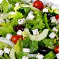 Greek Salad · Crisp romaine lettuce, ripe tomatoes, feta cheese, kalamata olives, fresh onions, crunchy gr...