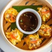 Shrimp Dumplings (5) · Homemade shrimp dumpling served with garlic-ginger soy sauce.