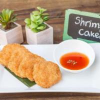 Shrimp Cake · Fried minced shrimp coated with bread crumb. Served with sweet chili sauce.