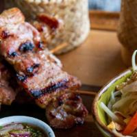 Moo Ping (4) · Seasoned grilled pork skewer served with white sticky rice and Thai chili sauce.  Recommend ...