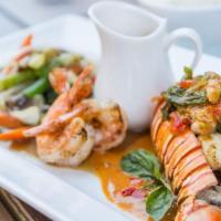 Lobster Panang · Gluten-free. Lobster tail and shrimps grilled in garlic butter sauce topped with panang curr...