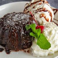 Molten Chocolate Cake · Our moist dark chocolate cake enrobed  with dark chocolate... filled with dark chocolate tru...