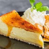 Creme Brulee Cheesecake · The marriage of two great classics... creme brulee layered and a-mingle with the lightest of...