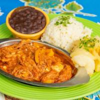 Mom'S Ropa Vieja · The oldest dish in Cuban cuisine - braised, shredded steak in a rich sauce of tomatoes, onio...