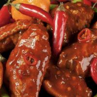 20 Krazie Hell Fire Wings · Smoked wings tossed in Hell Fire sauce and topped with fresh cut peppers.