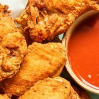 12 Pieces · The Best Wings Guaranteed
Our Wings Come Naked w/ Sauce On The Side For Dipping
Our Wings Ar...