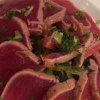 Tuna Tataki · Thin slices of seared tuna with ponzu sauce.