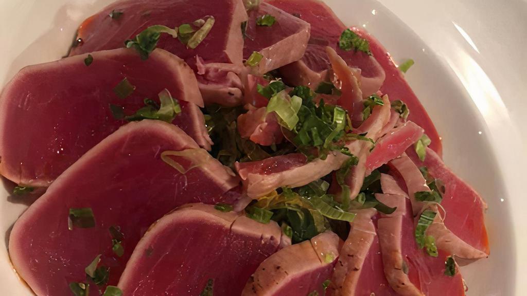 Tuna Tataki · Thin slices of seared tuna with ponzu sauce.