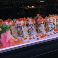 Red Dragon Roll · Shrimp tempura and avocado topped with spicy tuna mix and masago served with eel and spicy m...