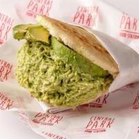 Arepa Reina Pepiada · Arepa filled with shredded chicken mixed with avocado.