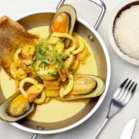 Pescado A Lo Macho · Shrimp, calamari, octopus, and mussels sauteed in creamy aji amarillo sauce with white rice.