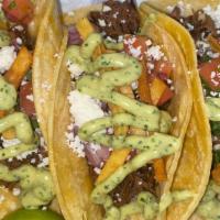 Barbacoa Brisket · (3 pieces) braised brisket, pico de gallo, tortilla strips, queso fresco, avocado crema.