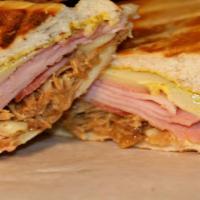Cuban Sandwich Hot · Hot Sandwich with Fresh Mojo Pork/Ham/Lettuce/Tomatoes/Mayo/Shoestring chips