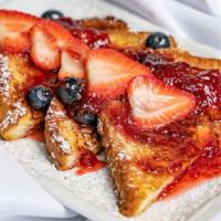 French Toast · 300 cal. Choice of fruits, maple syrup, sausage, or bacon.
