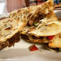 Quesadilla · Serve with one  choice of Beef, Steak, Chicken, Fish (Taplia), or Shrimp

Inside of the Taco...