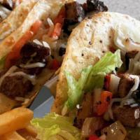 Taco · Serve with one  choice of Beef, Steak, Chicken, Fish (Taplia), or Shrimp

Inside of the Taco...