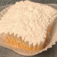 Poundcake Cupcake · A traditional Pound cake topped with powdered sugar.