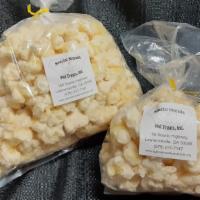 Choc-Corn · Premium white coated puff-corn that is gluten free, kernel-less and hull-less. A specialty o...