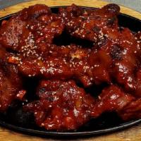 Bul Jok (불족발) · Grilled fired spicy pork hocks.