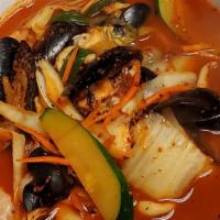 Jjam Ppong (짬뽕) · Spicy noodle soup with assorted seafood.