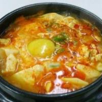 Seafood Soup (해물순두부) · Spicy soft tofu soup with seafood, vegetables, and egg.