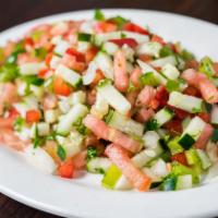 Lebanese Salad · Tomatoes, cucumbers, green and red bell peppers, onions, parsley, herbs, spices, olive oil, ...