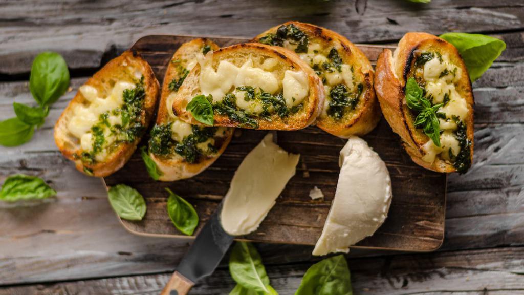Garlic Cheese Bread · Fresh baked bread with melted cheese and garlic.