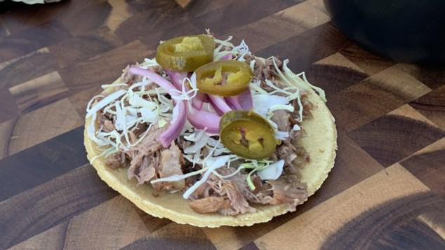 Carnitas · Pulled pork served with cabbage, pickled red onion and jalapeno.