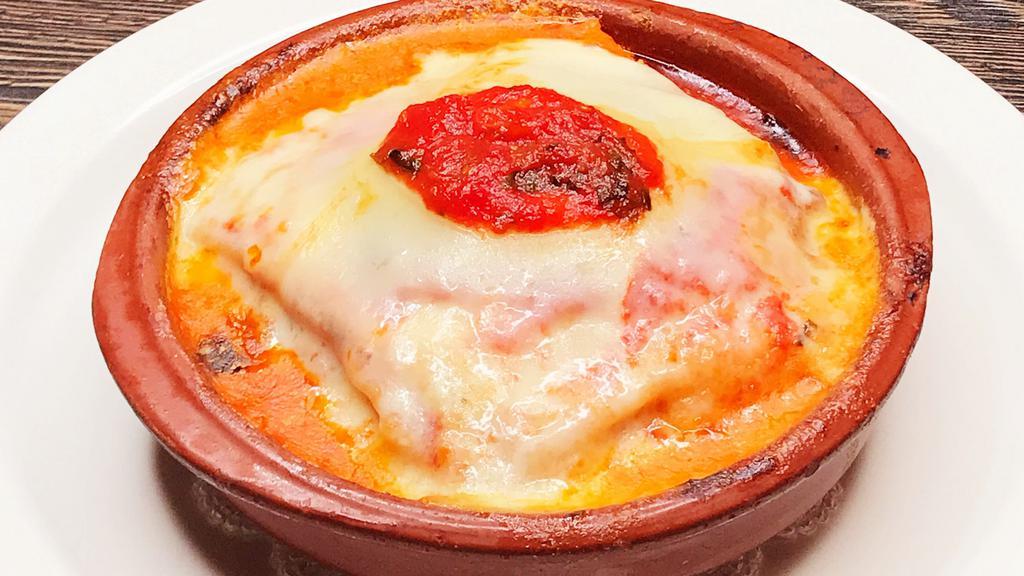 Lasagna · Homemade Lasagna Pasta Layered with Bolognese
Sauce, Parmigiano Cheese & Bechamel Sauce