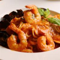 Linguine Con Frutos Del Mar · Clams, mussels, fish, and shrimp served over a bed of linguine pasta in marinara sauce serve...