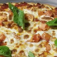 Pizza Margherita · Marinara Sauce, Fresh Tomato Chopped, Mozzarella Cheese Chunks & Fresh Basil Leaves.
