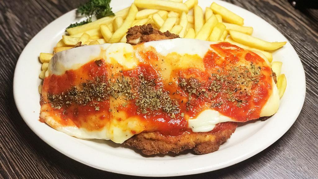 Milanesa A Napolitana · Breaded Beef or Chicken with Tomato Sauce, Ham & Mozzarella Cheese