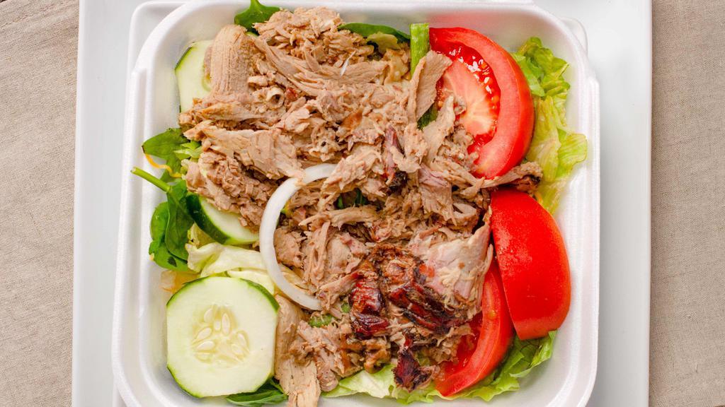 Bar-B-Q Salad · Why not turn a salad into a meal? pick one of your favorite barbecue meats to be piled high on top a bed of lettuce with onions, green peppers, tomatoes, cucumbers and shredded cheddar cheese!  Add chicken, pork, beef, or turkey for an additional charge.