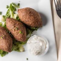 Kibbeh Ball (3 Pc) · Crushed wheat mixed with meat, stuffed with meat, onion and spices.
