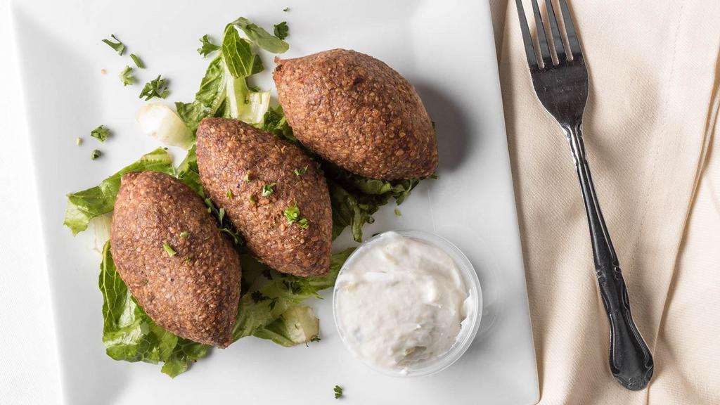 Kibbeh Ball (3 Pc) · Crushed wheat mixed with meat, stuffed with meat, onion and spices.