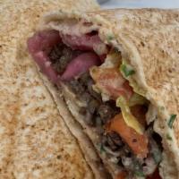 Shawarma Beef Wrap · Tender beef, tomato, onion & tahini sauce